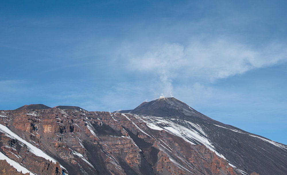 brown and white mountain under blue sky during daytime