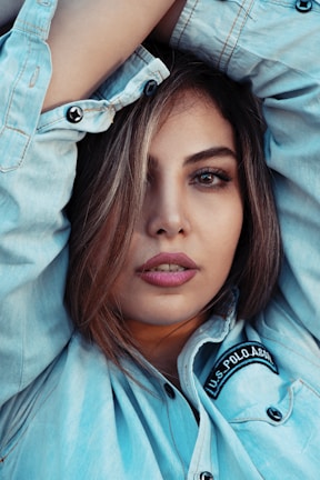 Close-up of a serene face wearing a relaxed-fit t-shirt with an uplifting mental health message.