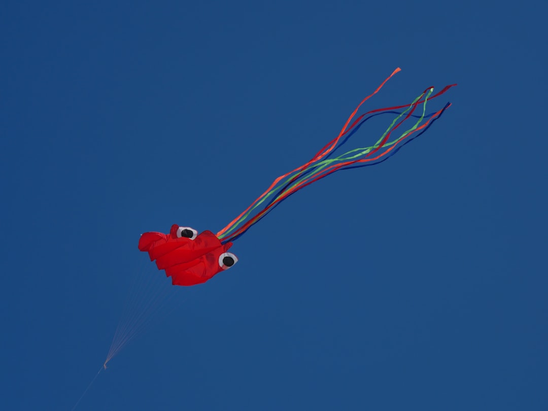 red heart balloon in blue sky