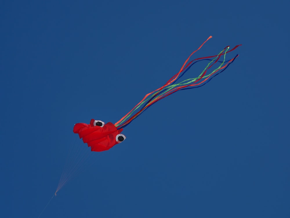 red heart balloon in blue sky
