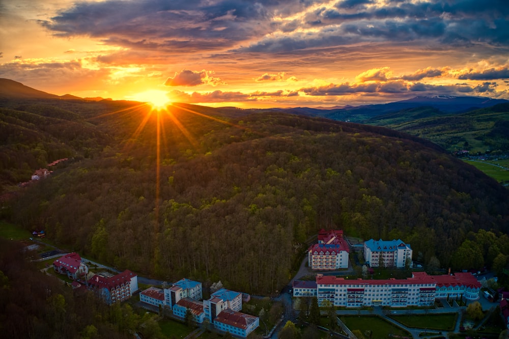 aerial view of green mountain during sunset