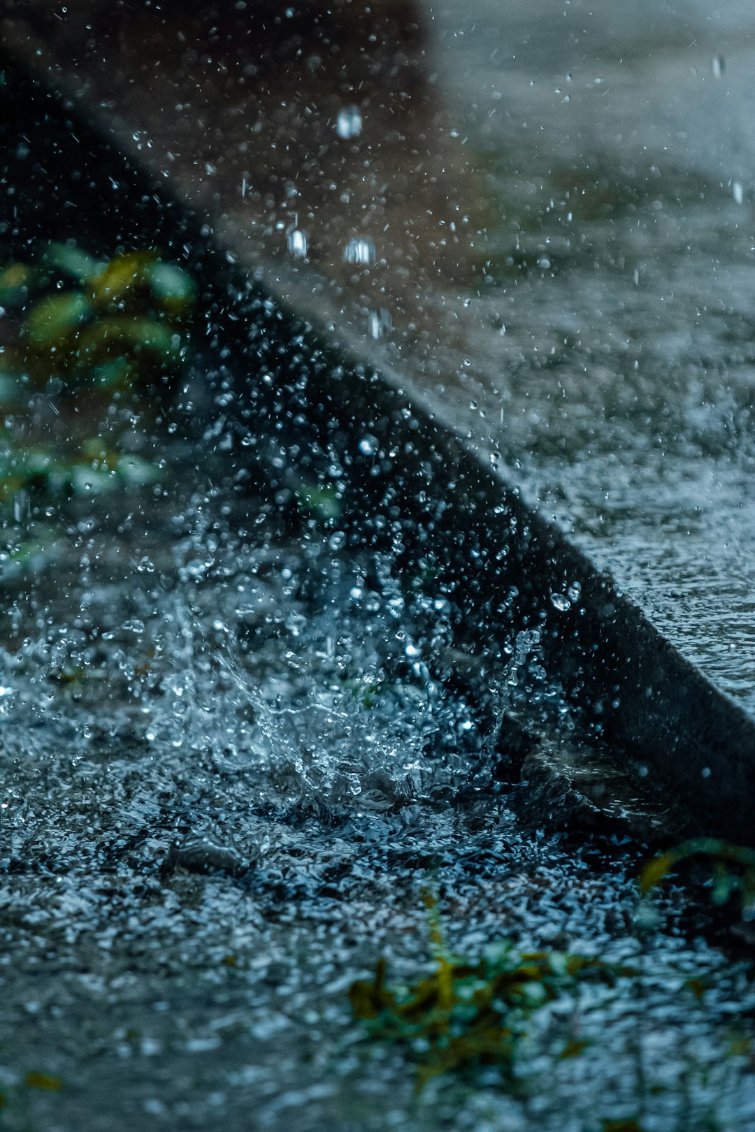 water splash on gray rocky shore during daytime