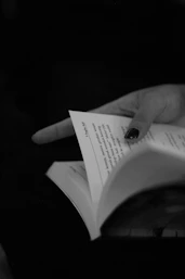 a person holding a book in their hands