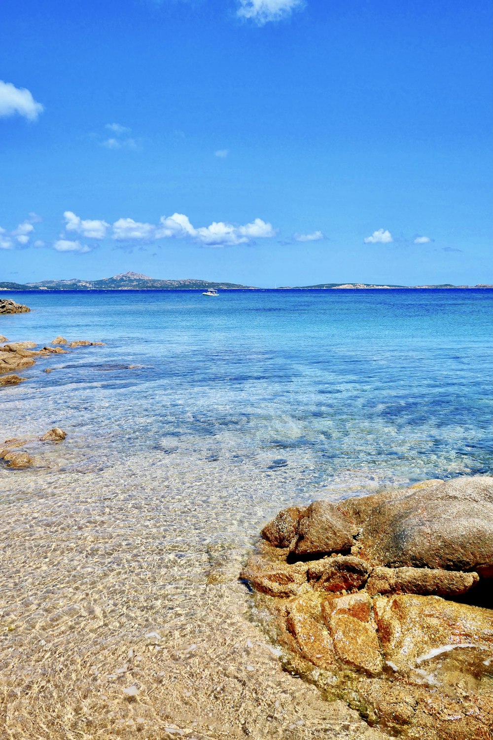 brown rock formation on sea shore during daytime