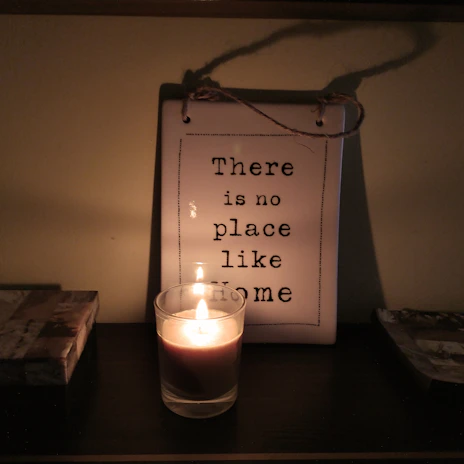 Close-up of a cozy home with a glowing shield icon overlay, symbolizing protection and care.