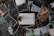 A variety of photographs surround a central image of a clipboard with the word 'Depression' typed on it. The surrounding photos depict individuals in various poses of distress or contemplation, suggesting themes of sadness, loneliness, and introspection.