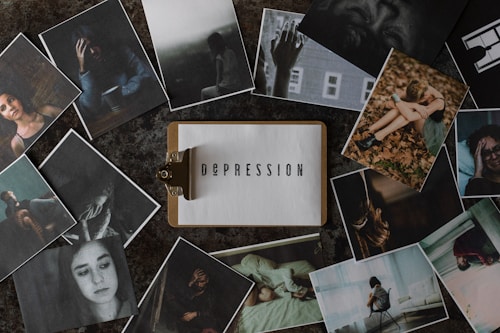 A variety of photographs surround a central image of a clipboard with the word 'Depression' typed on it. The surrounding photos depict individuals in various poses of distress or contemplation, suggesting themes of sadness, loneliness, and introspection.