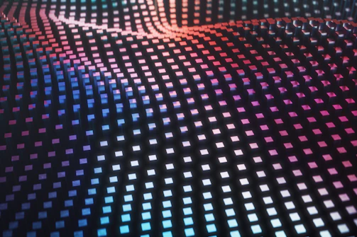 A grid of cubes forming a wave pattern with blue and pink lighting