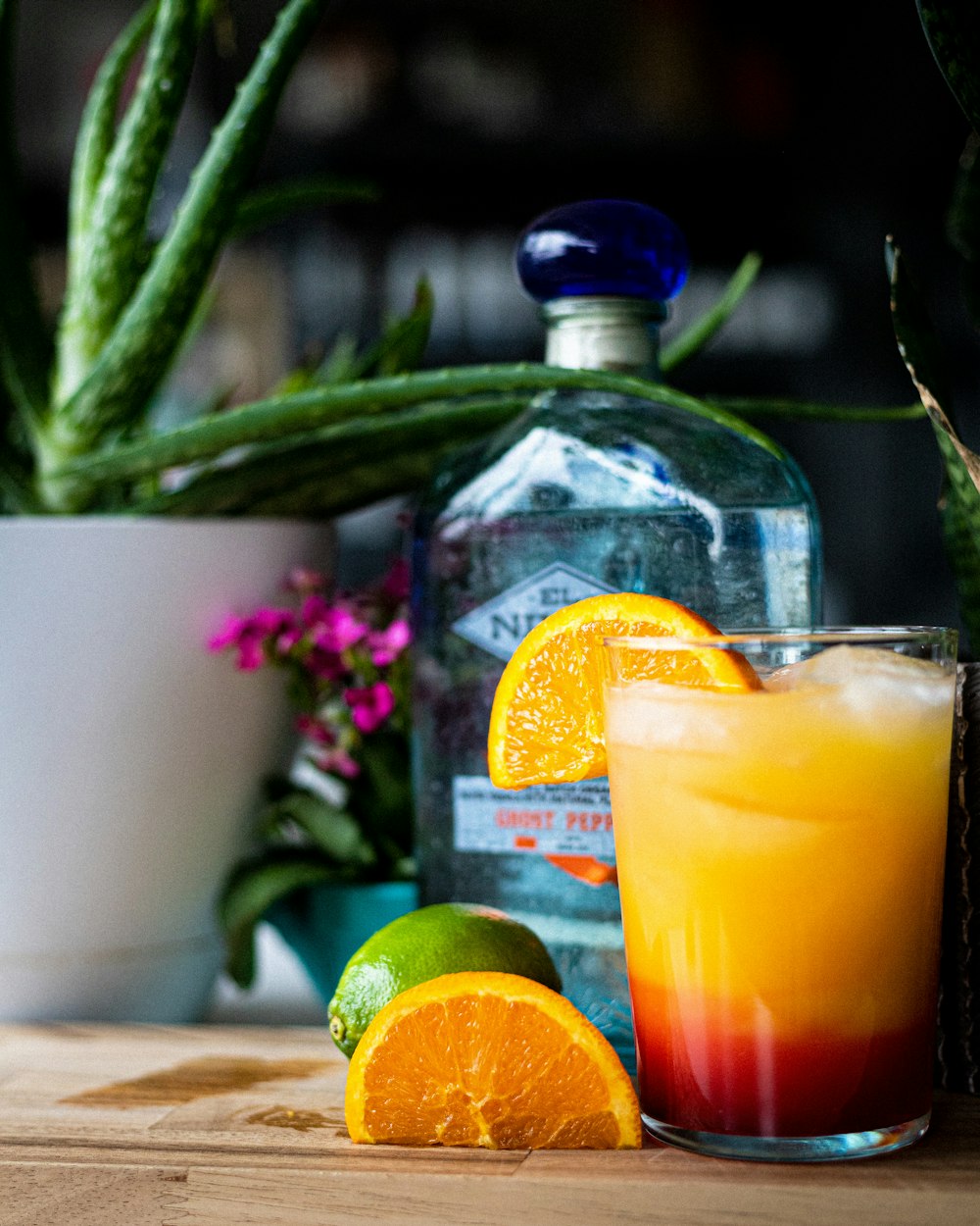 orange juice in clear drinking glass