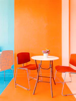 Bright, cheerful therapy room decorated with yellow and purple accents reflecting the brand colors.