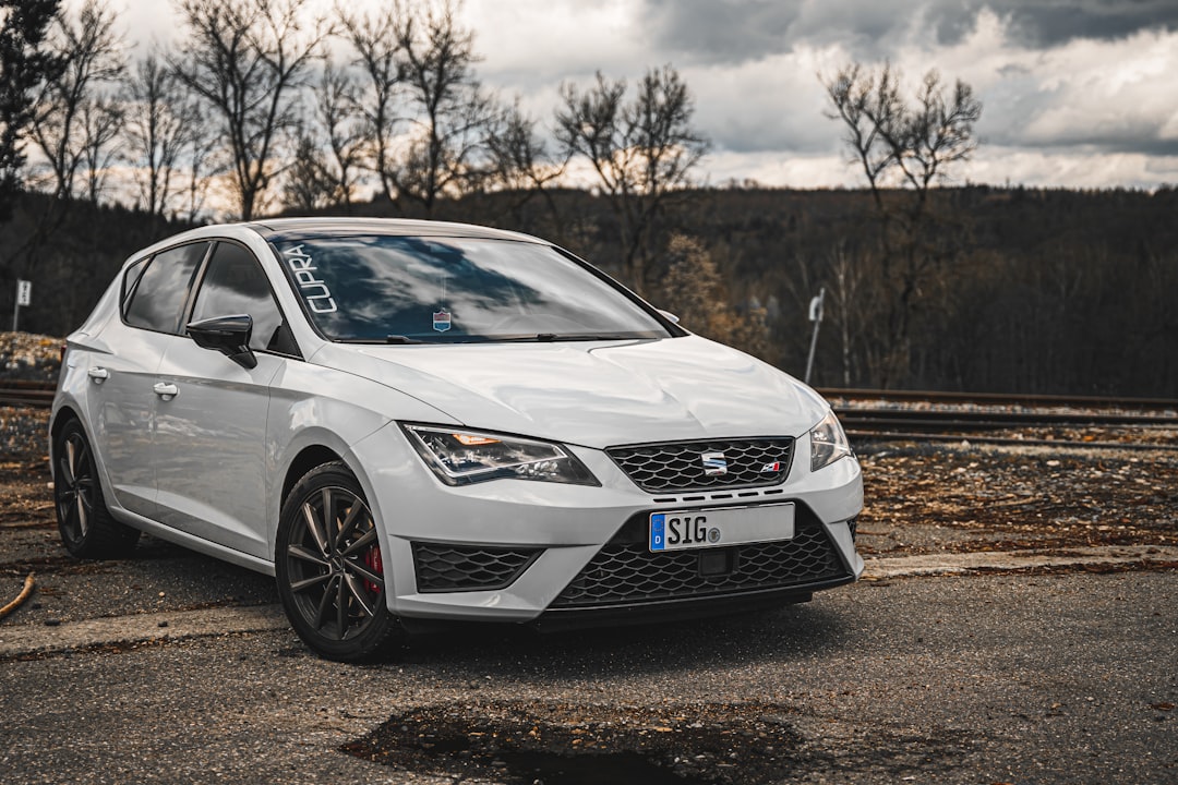 white honda car on dirt road during daytime