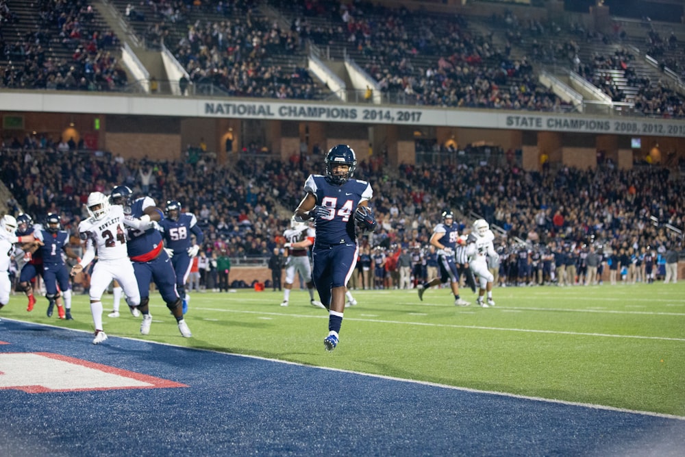 football players on field during daytime