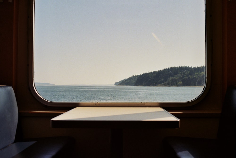 body of water near green trees during daytime