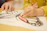 A happy child coloring a biblical illustration with bright crayons.