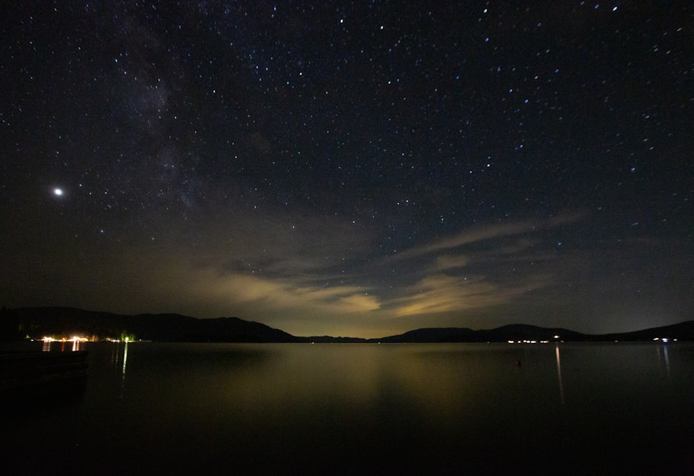 body of water under starry night