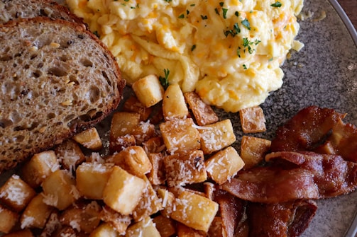 A hearty keto breakfast featuring bacon, eggs, and avocado.