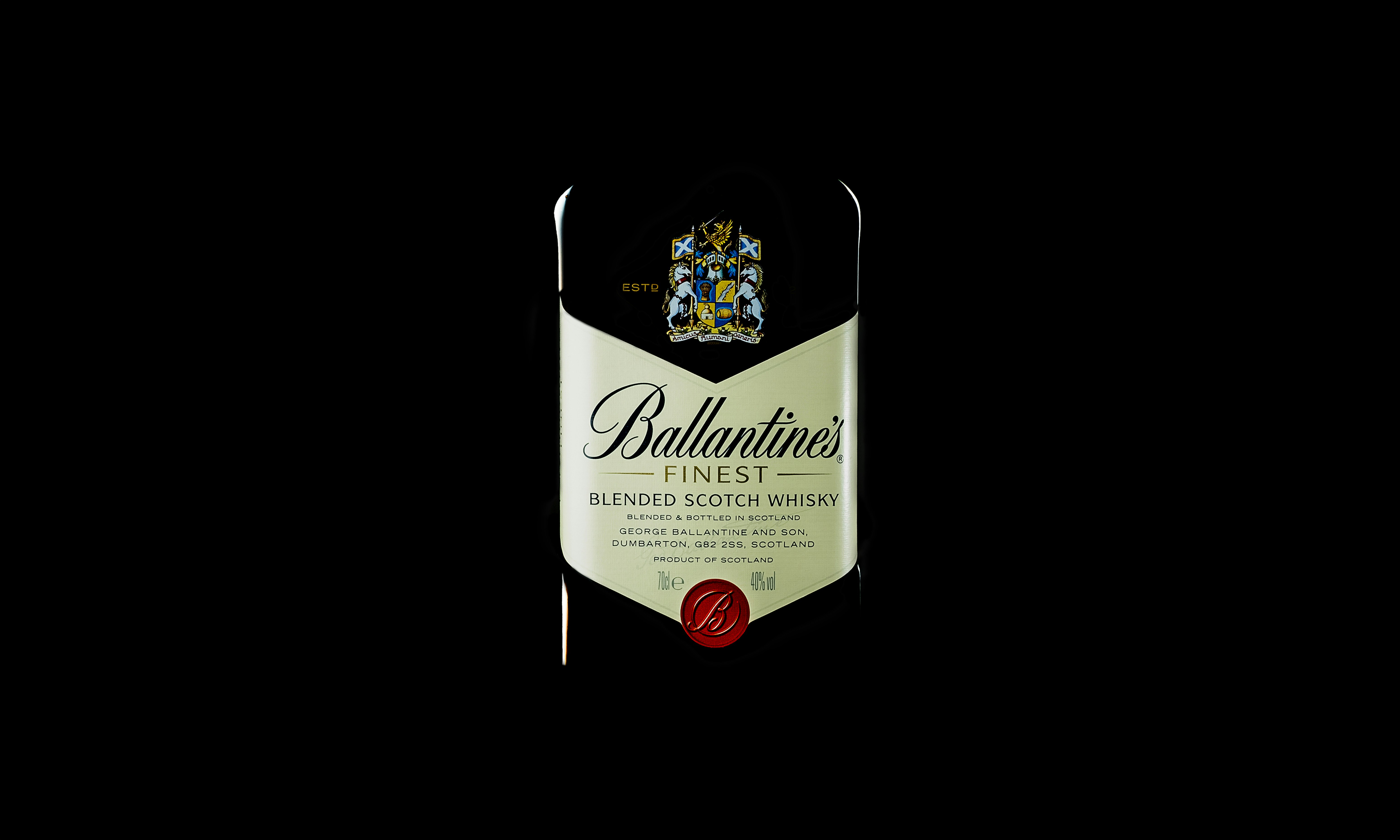 a bottle of wine on a black background