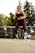 A happy customer wearing vibrant activewear from Fashiondrift while exercising outdoors.