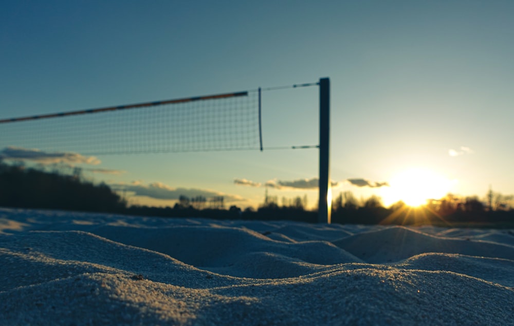 white snow covered field during sunset