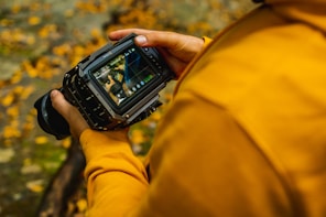 person holding black digital watch