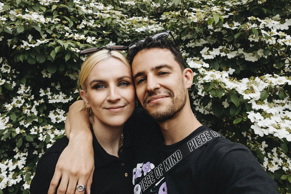 man in black crew neck shirt beside woman in black crew neck shirt