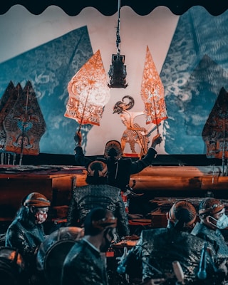 Traditional Javanese shadow puppet performance with intricate leather puppets