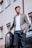 A well-dressed man showcasing a smart casual outfit in an urban setting.