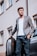 A well-dressed man showcasing a smart casual outfit in an urban setting.