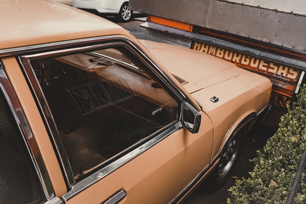 yellow car on parking lot