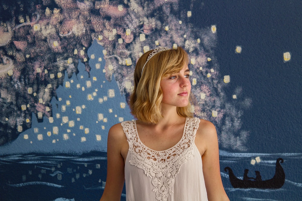 woman in white floral sleeveless dress