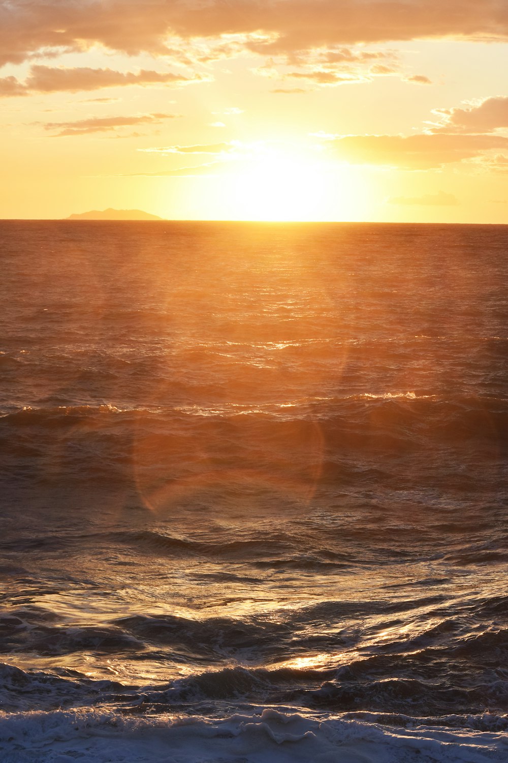 body of water during sunset