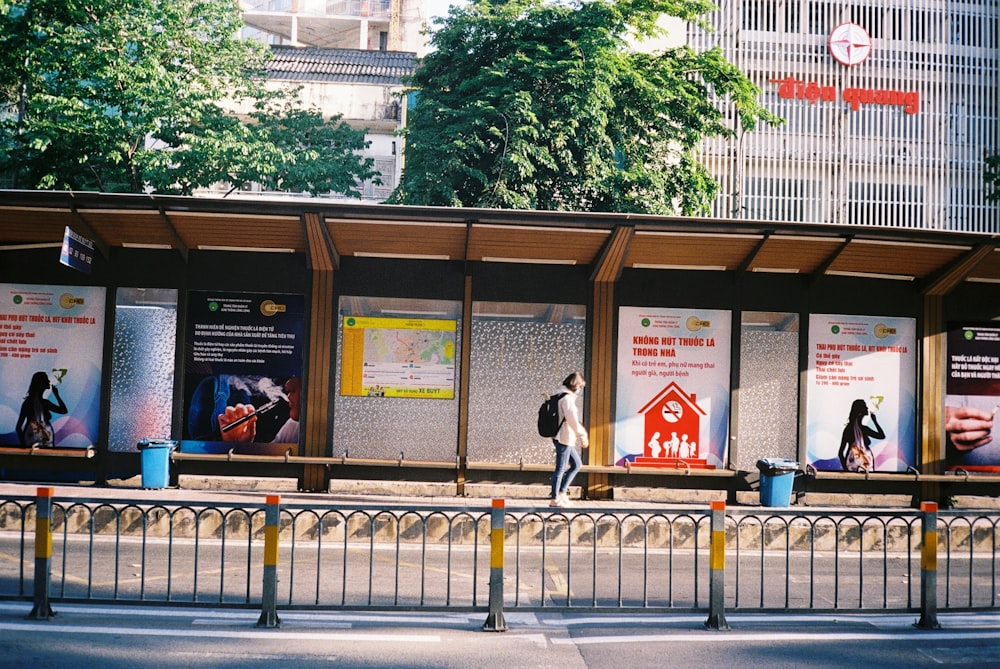 people sitting on bench near building during daytime