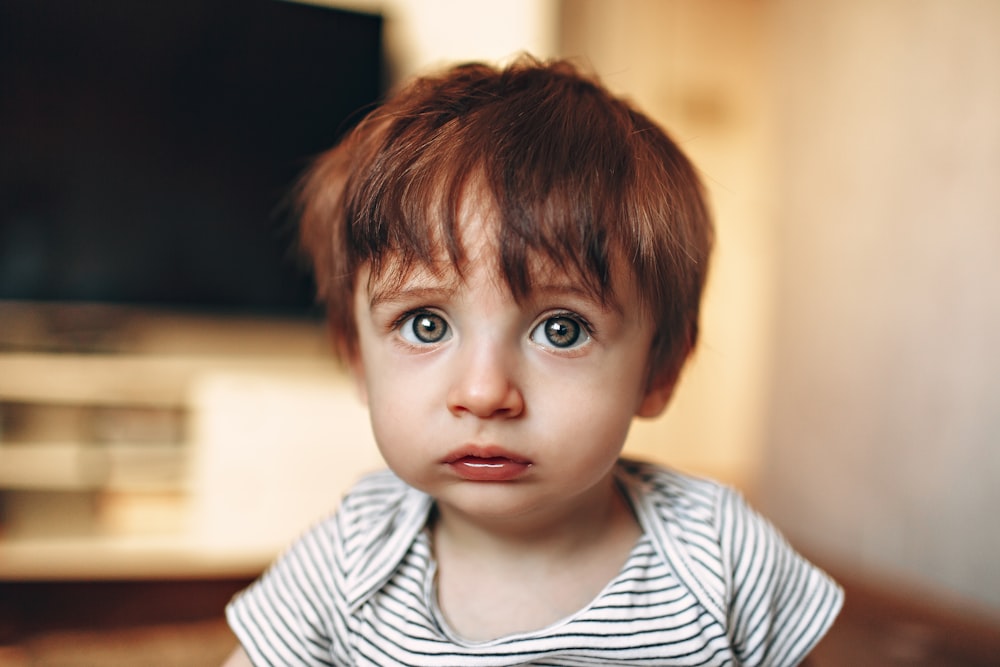 boy in white and black striped crew neck shirt