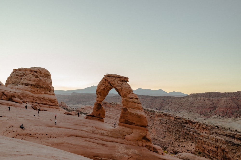 brown rock formation under white sky during daytime