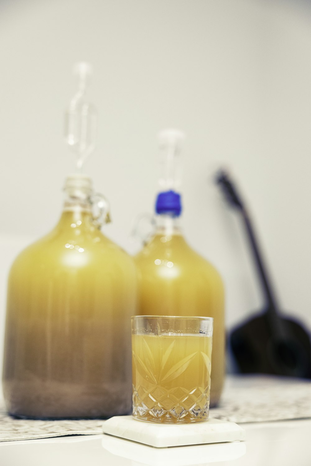 clear glass bottle with orange liquid