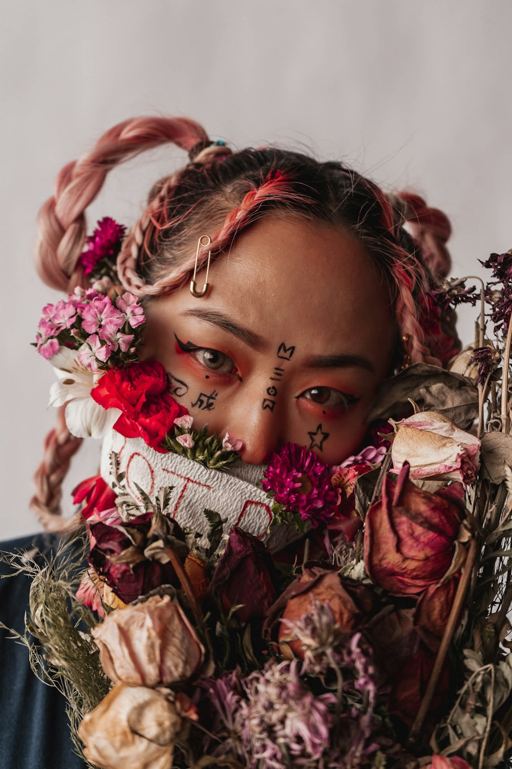 girl with pink and white floral headdress