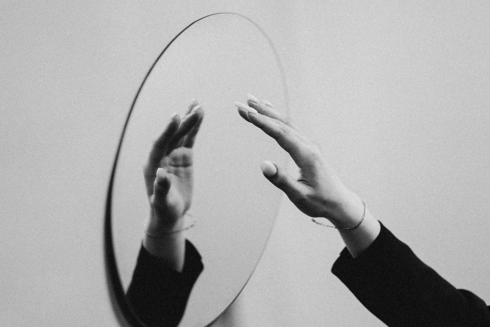 Fragmented mirror reflections creating multiple overlapping images, some clear and others warped and unclear