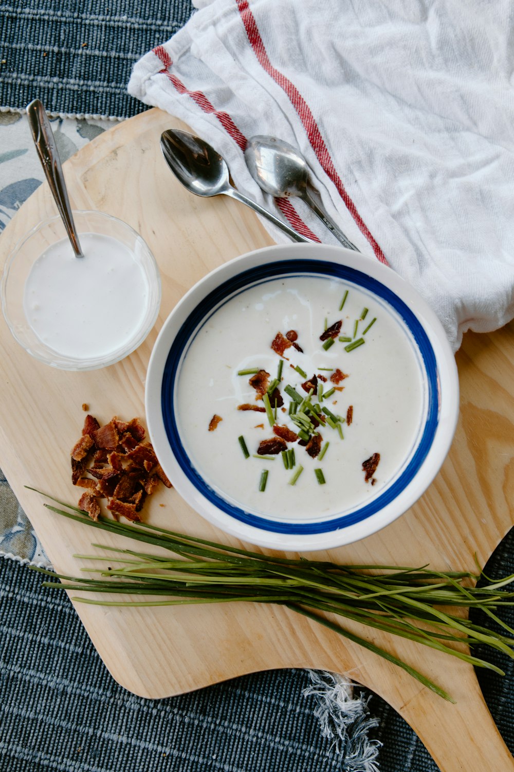 white and blue ceramic bowl with soup