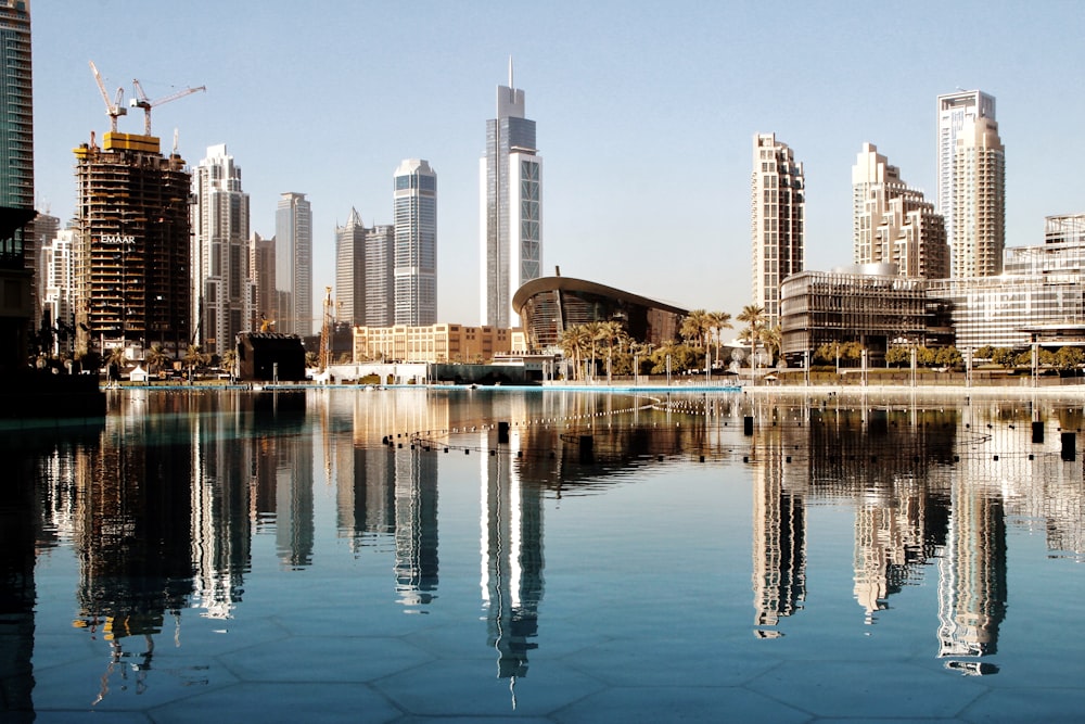 city skyline across body of water during daytime