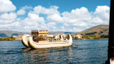 brown and white boat on water during daytime
