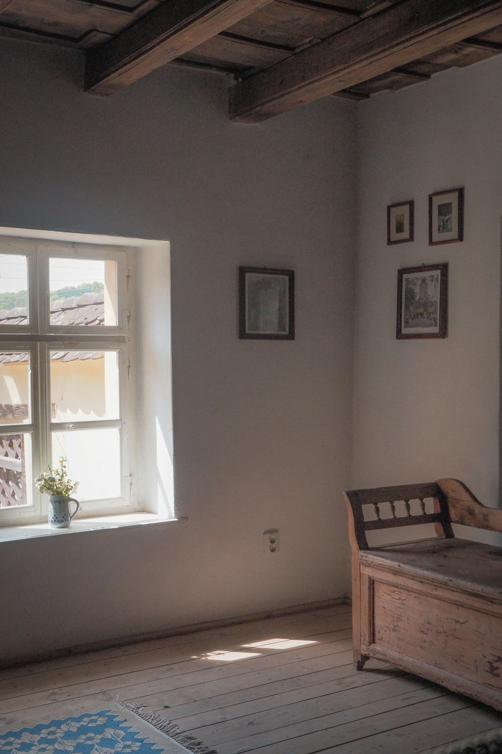 brown wooden table near window