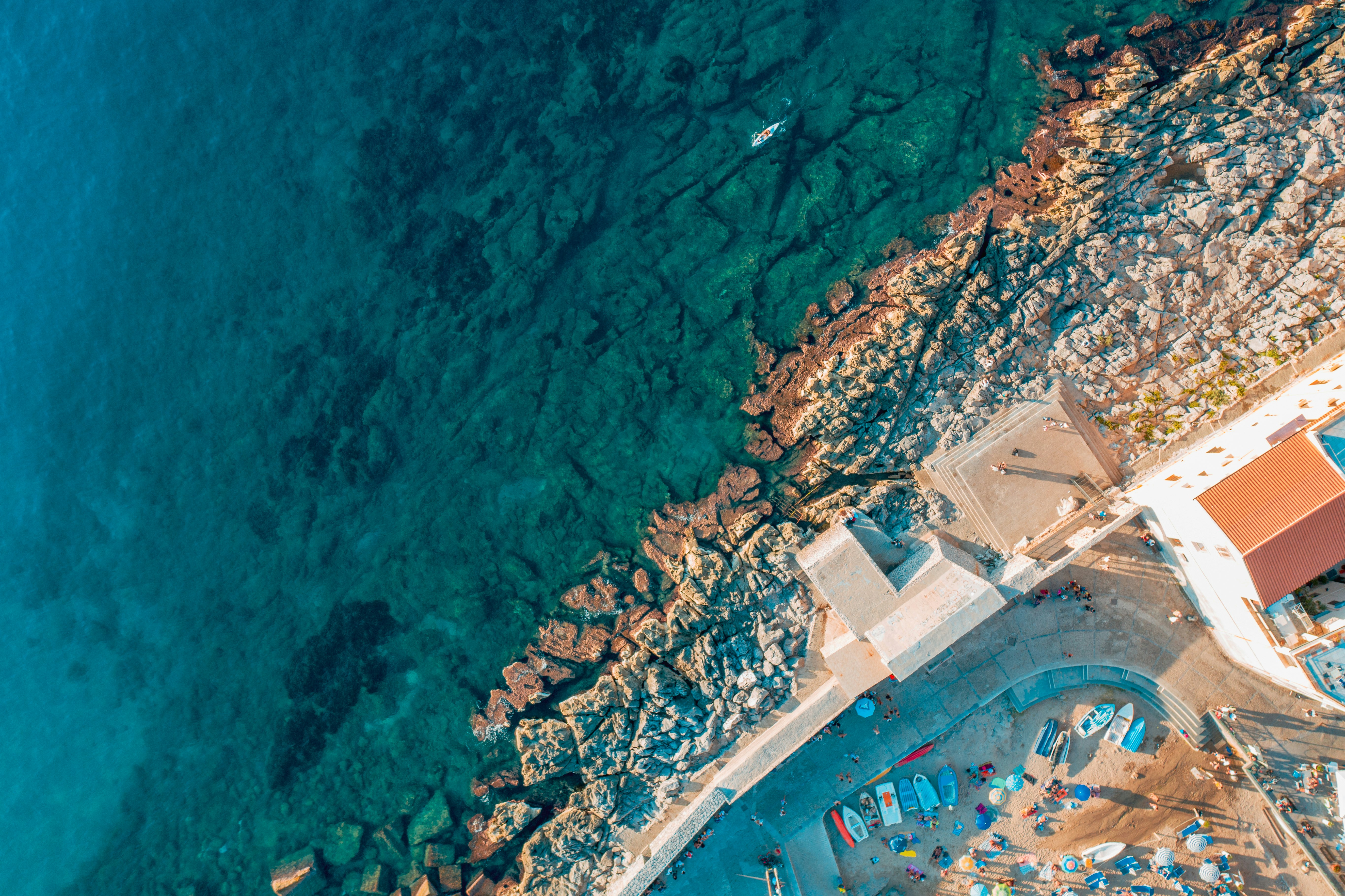 aerial view of city buildings near body of water during daytime