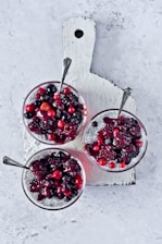A cozy kitchen scene with a bowl of chia pudding topped with fresh berries and a spoon ready to enjoy.