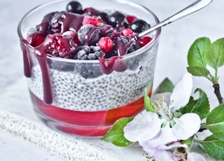 strawberry and blackberry in clear glass cup