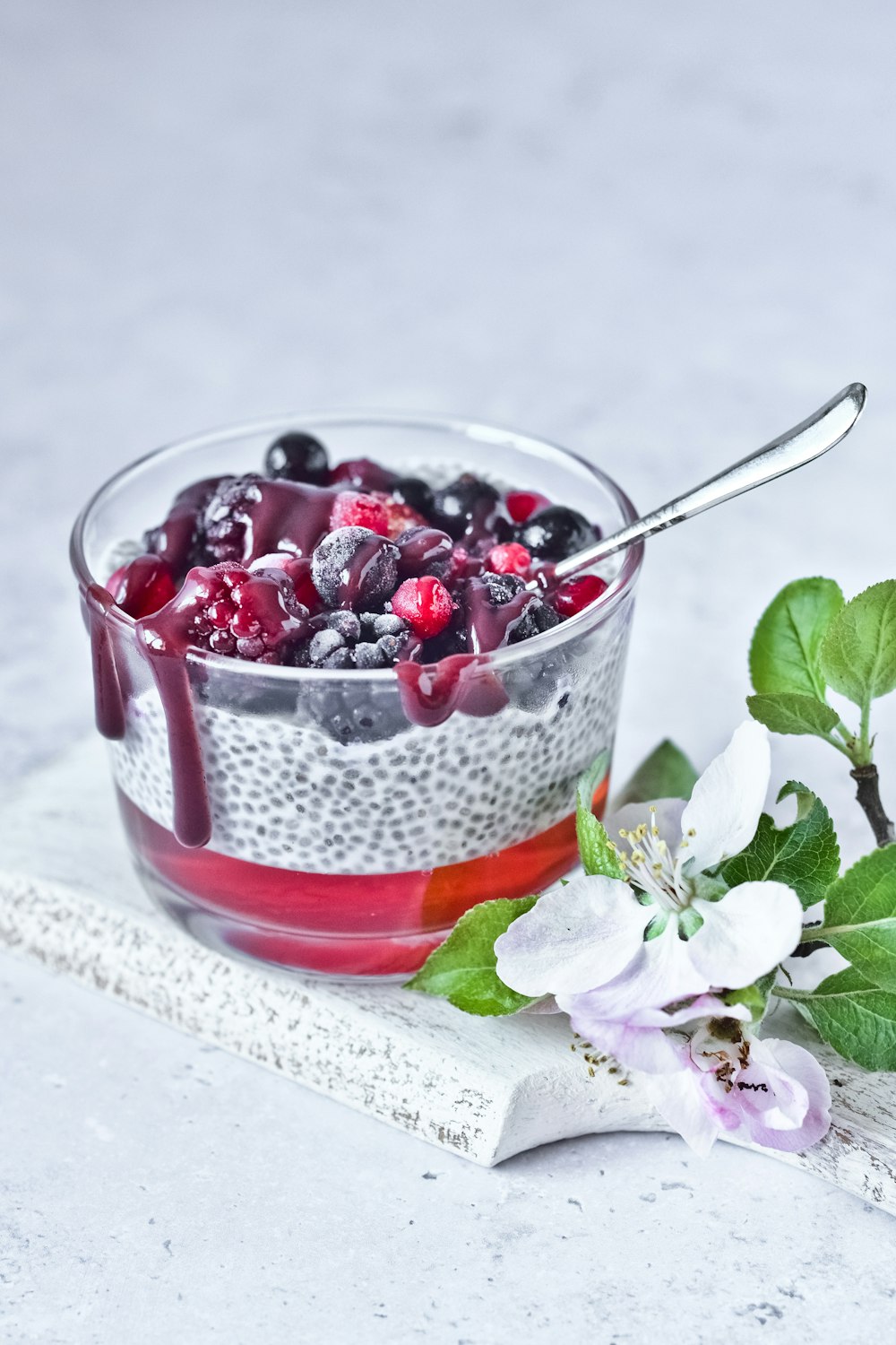 strawberry and blackberry in clear glass cup