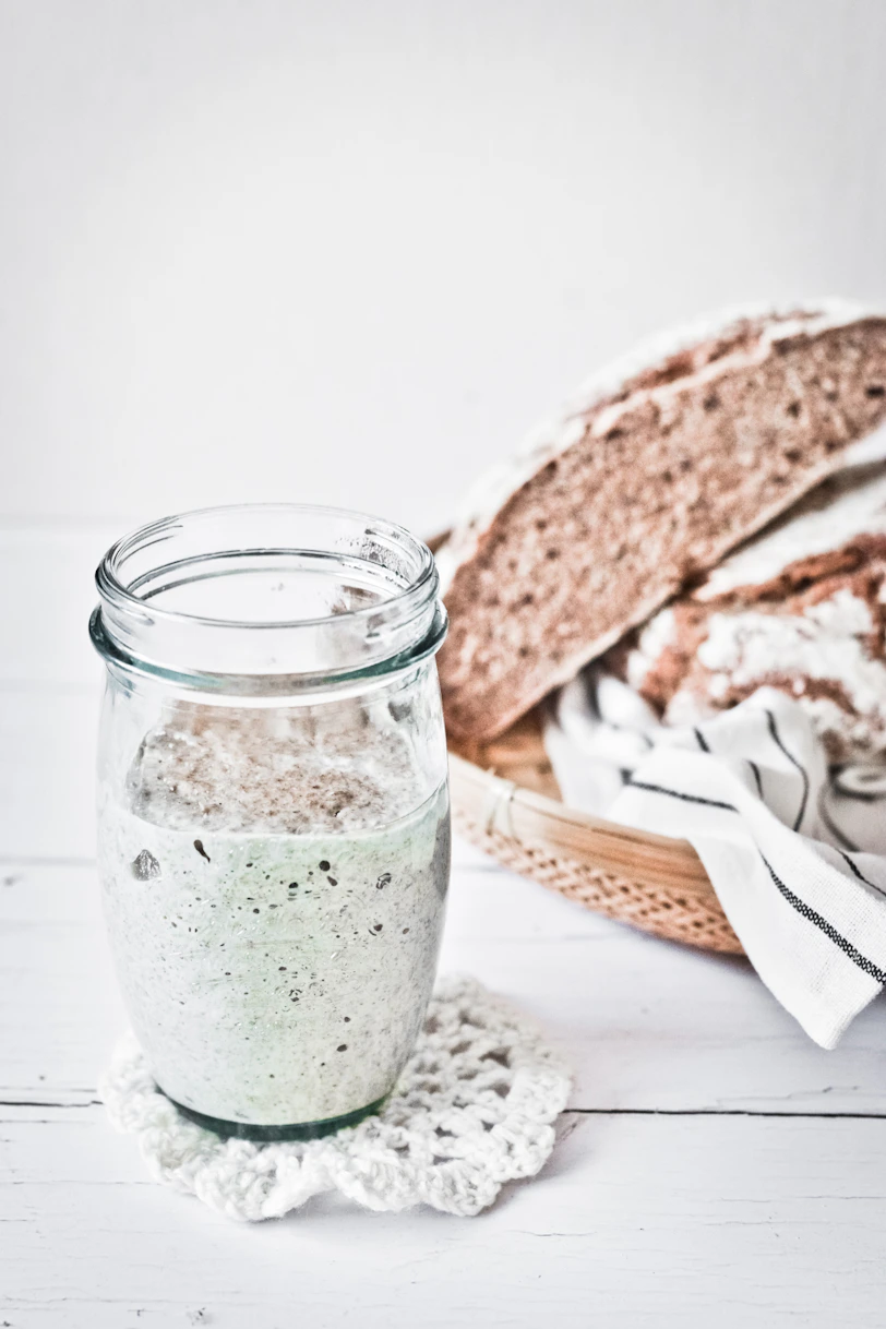 clear glass jar with green liquid