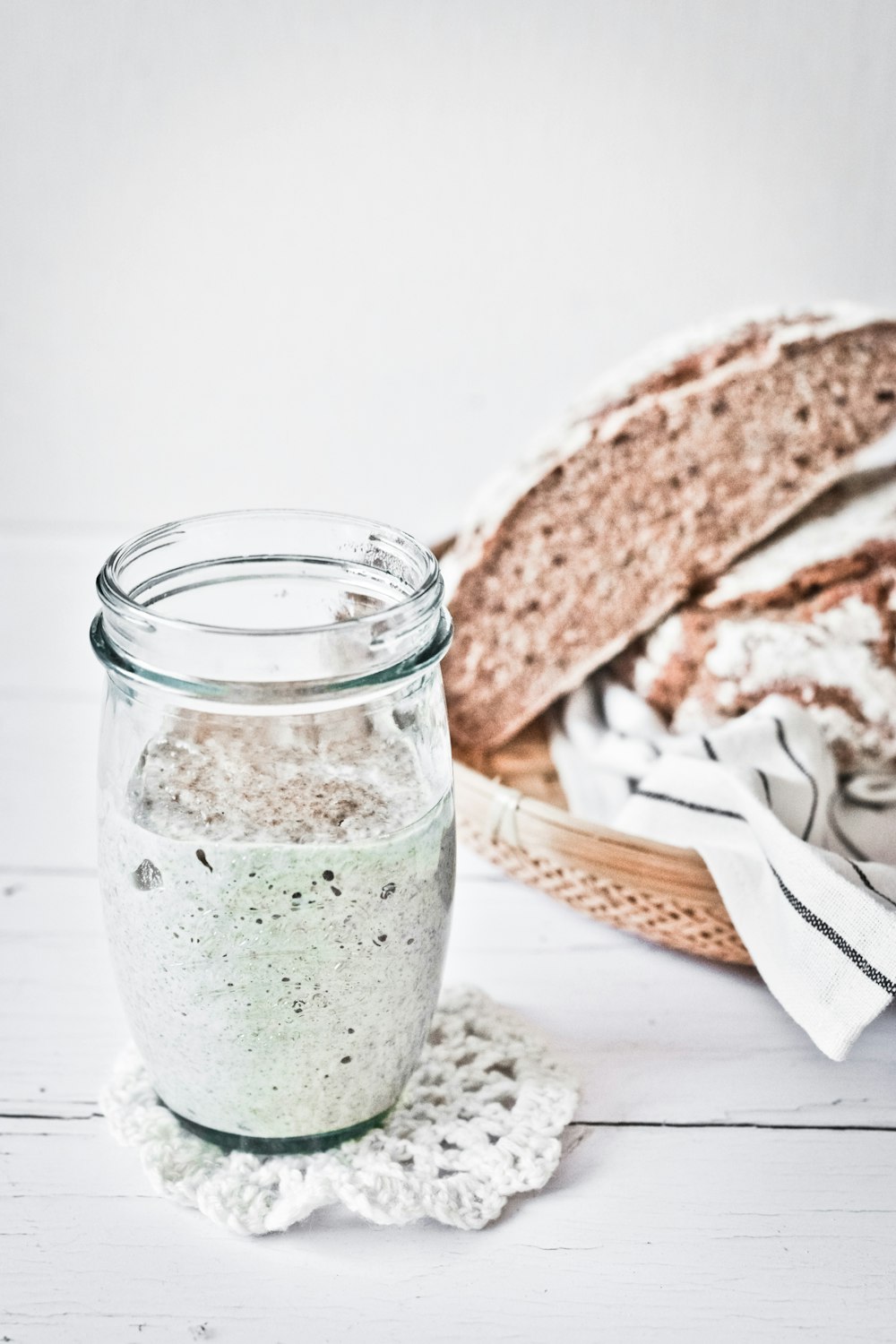 clear glass jar with green liquid