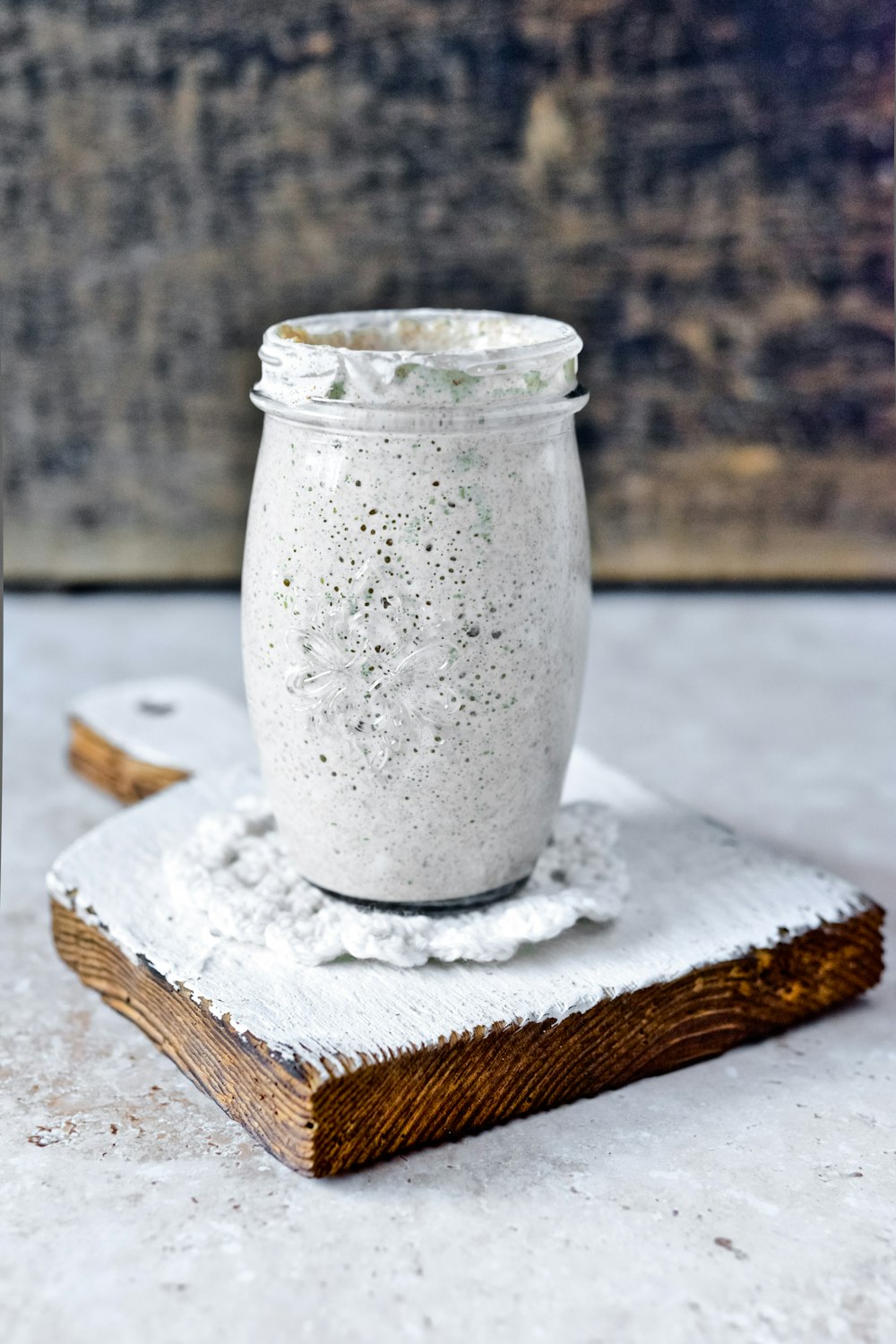 clear glass jar on white wooden table