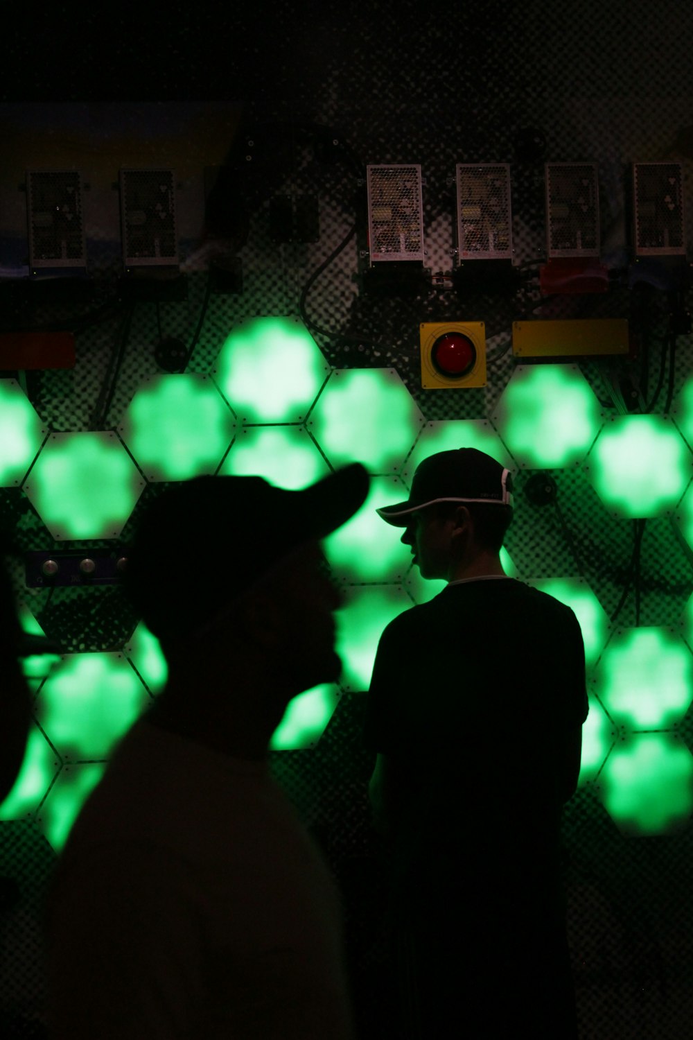 silhouette of man wearing hat