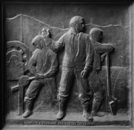 gray scale photo of man and woman statue